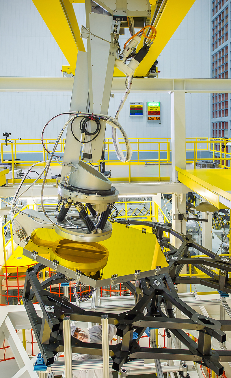 Illustration for article titled This Robotic Arm Slips James Webb's Mirrors Exactly Where They Need to Be